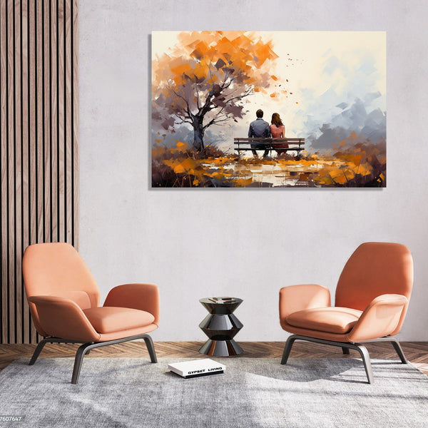 A Couple sitting on a bench next to a fall tree