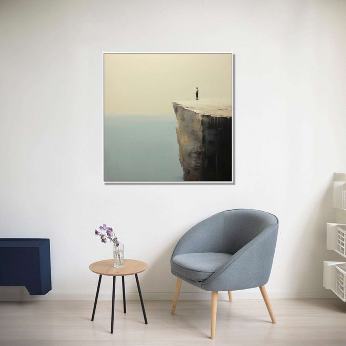 A lone man stands at the precipice of a cliff, gazing into the vast expanse of the sea below : Dining room Painting