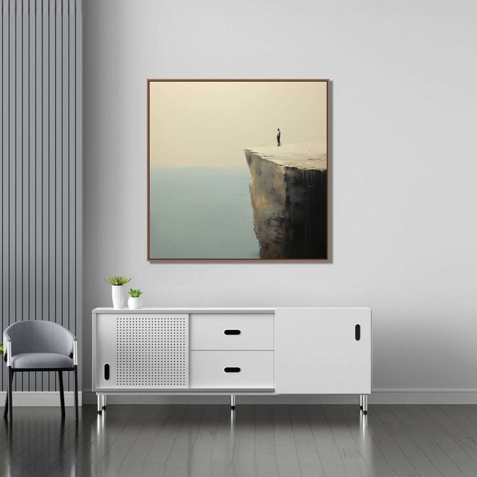 A lone man stands at the precipice of a cliff, gazing into the vast expanse of the sea below : Living room Paintings