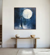 A lone man stands before a moon-shaped silhouette, deep navy blue background : Living room Paintings