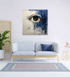 An open eye emerges against an abstract backdrop of deep, contemplative dark blue and the purity of white