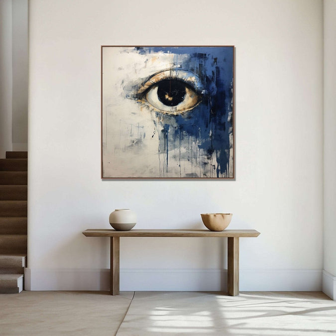 An open eye emerges against an abstract backdrop of deep, contemplative dark blue and the purity of white : Living room Paintings