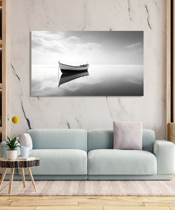 Minimalistic monochrome with a boat with clear reflection.