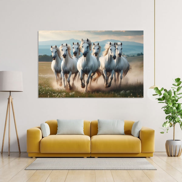 Seven white Horses running front on dusty ground and mountains in background