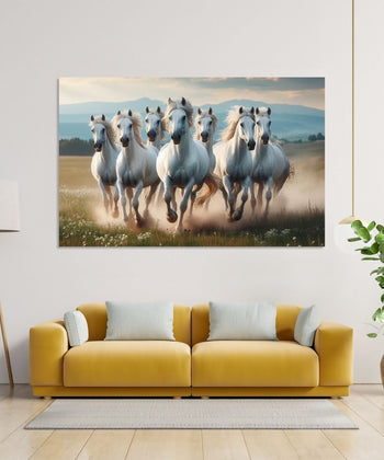 Seven white Horses running front on dusty ground and mountains in background