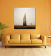 solitary figure stands beside a towering vertical stone henge