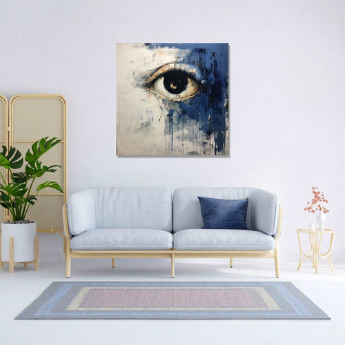 An open eye emerges against an abstract backdrop of deep, contemplative dark blue and the purity of white